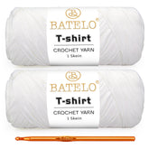 Two white BATELO T-shirt yarn skeins with a gold crochet hook on a white background