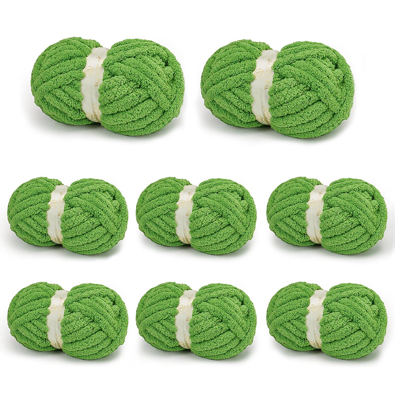 Eight bright green BATELO chunky chenille yarn skeins arranged on a white background