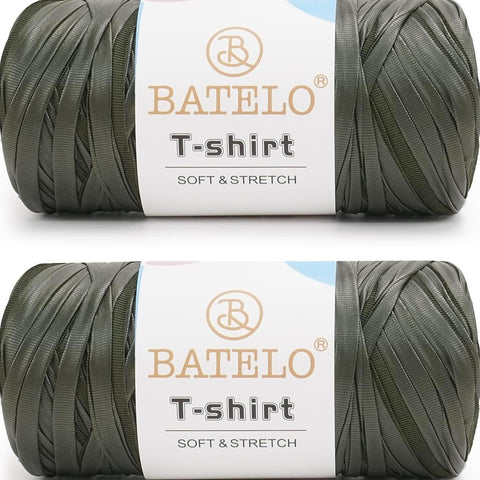 Two dark green BATELO leather-look T-shirt yarn skeins with branded labels on a white background