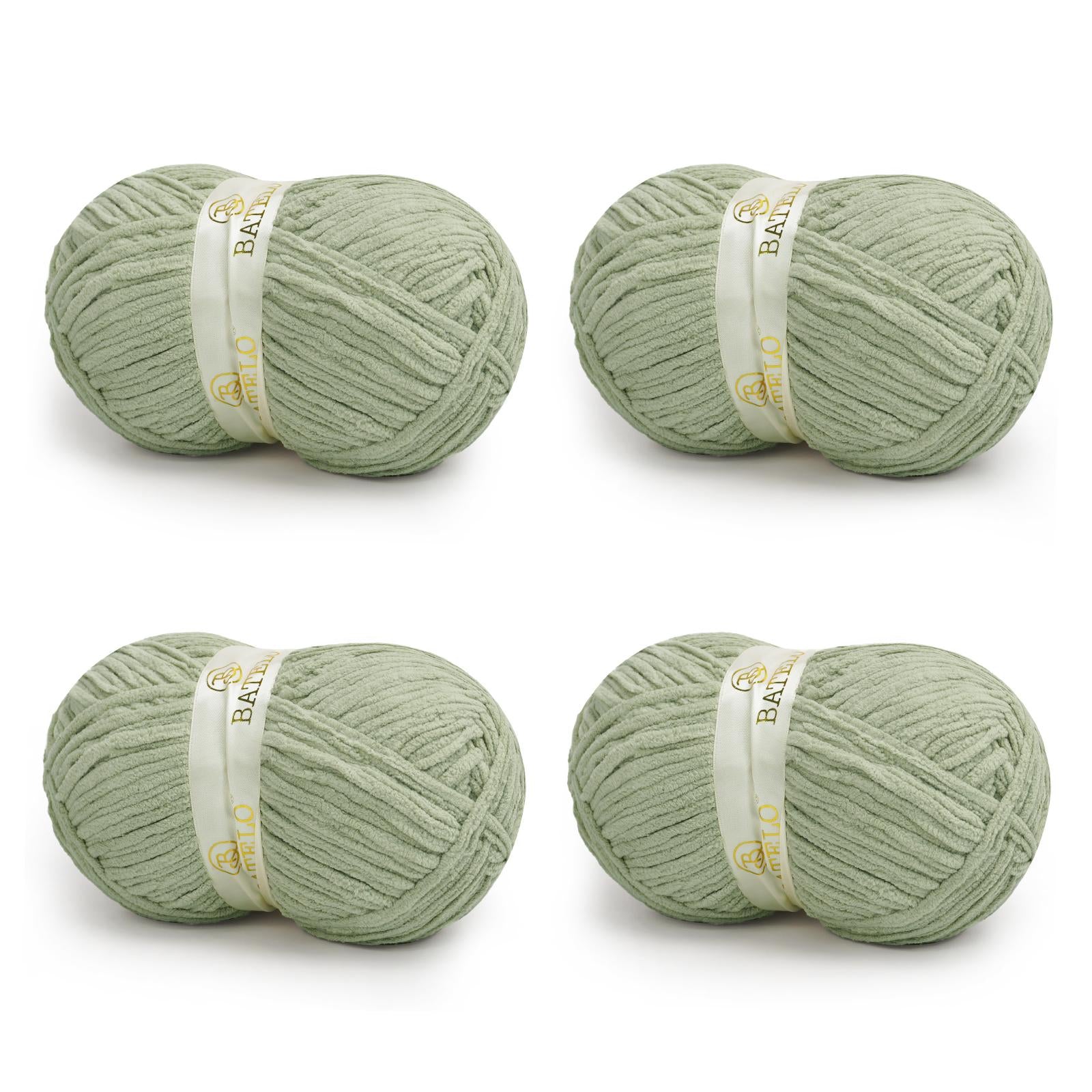 Four sage green BATELO bulky chenille blanket yarn skeins arranged on a white background
