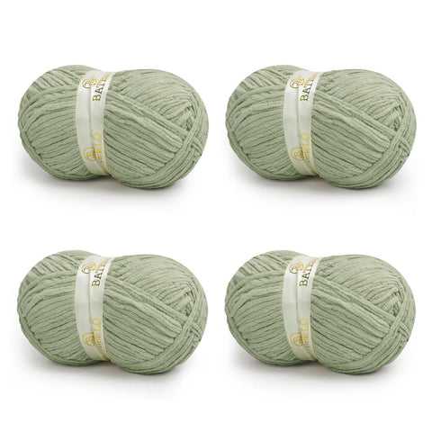Four sage green BATELO bulky chenille blanket yarn skeins arranged on a white background