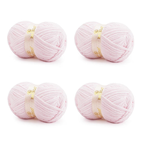 Four pale pink BATELO bulky chenille blanket yarn skeins arranged on a white background