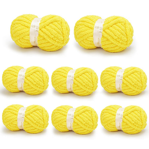 Eight yellow BATELO chunky chenille yarn skeins arranged on a white background