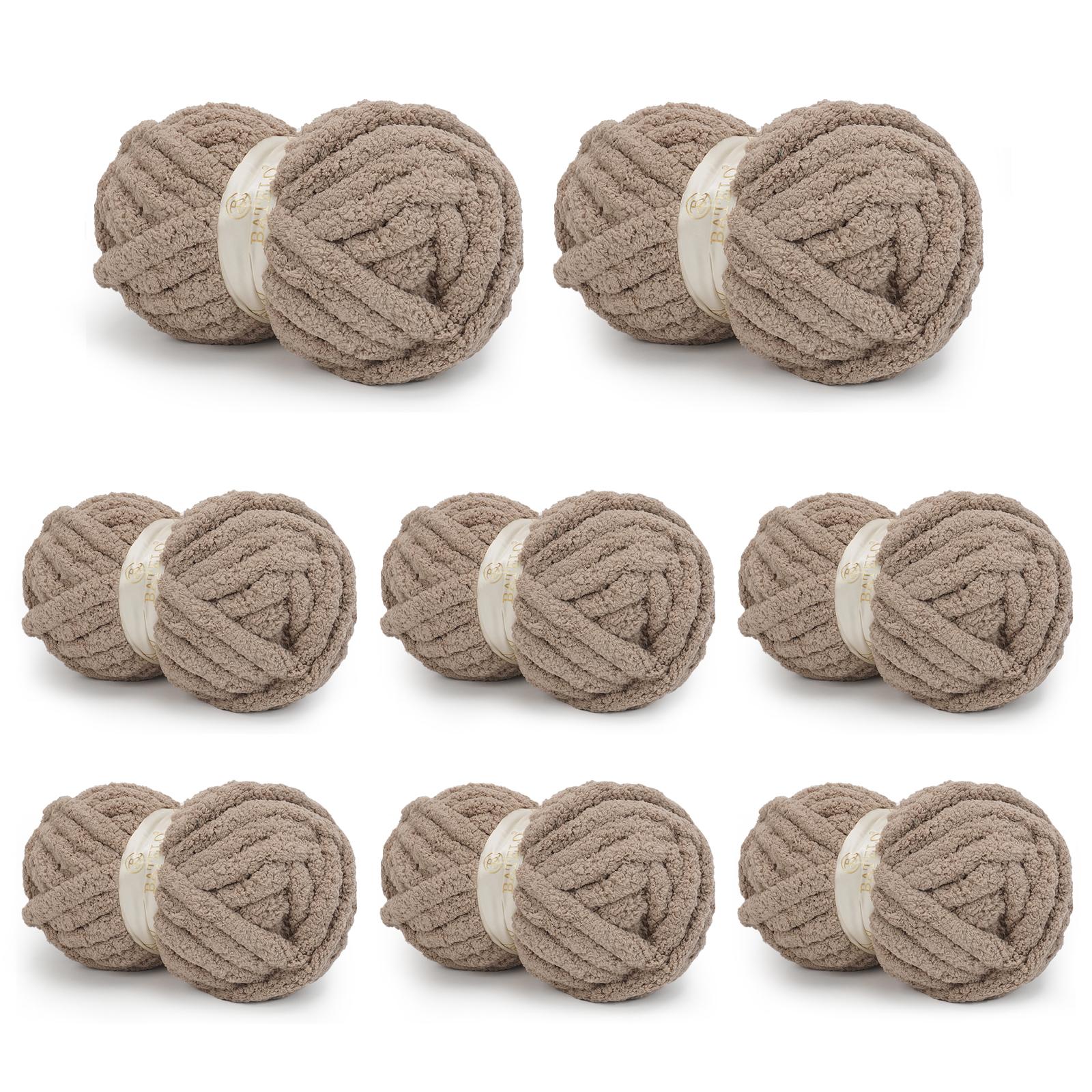 Eight taupe BATELO chunky chenille yarn skeins arranged on a white background
