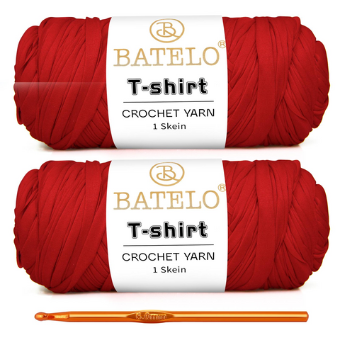 Two red BATELO T-shirt yarn skeins with a gold crochet hook on a white background