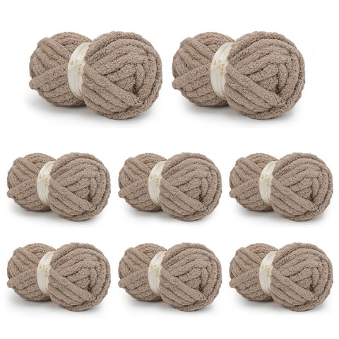 Eight taupe BATELO chunky chenille yarn skeins arranged on a white background