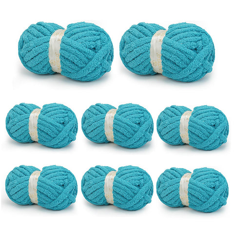 Eight turquoise BATELO chunky chenille yarn skeins arranged on a white background