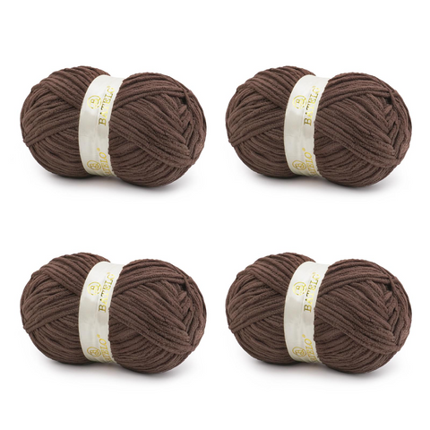 Four brown BATELO bulky chenille blanket yarn skeins arranged on a white background