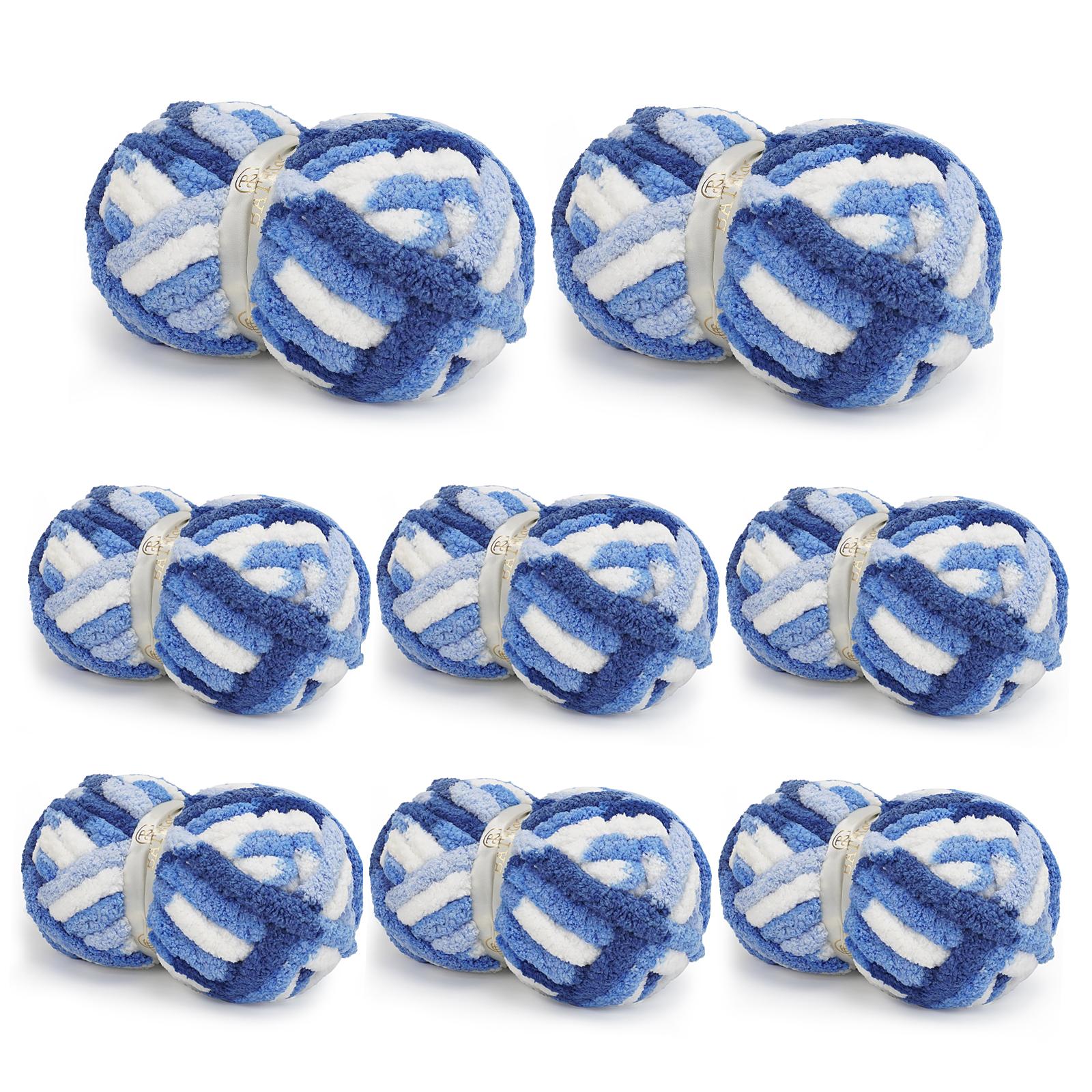 Eight blue-and-white variegated BATELO chunky chenille yarn skeins arranged on a white background