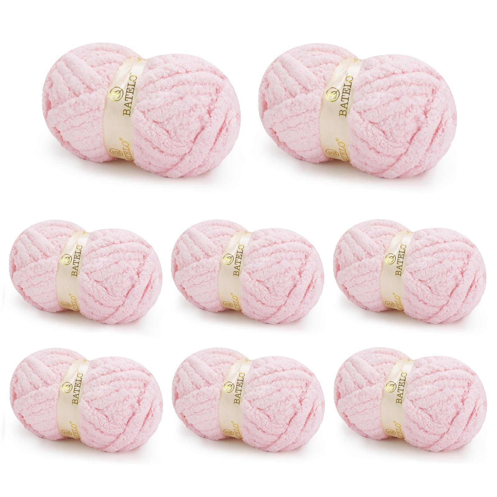 Eight pale pink BATELO chunky chenille yarn skeins arranged on a white background