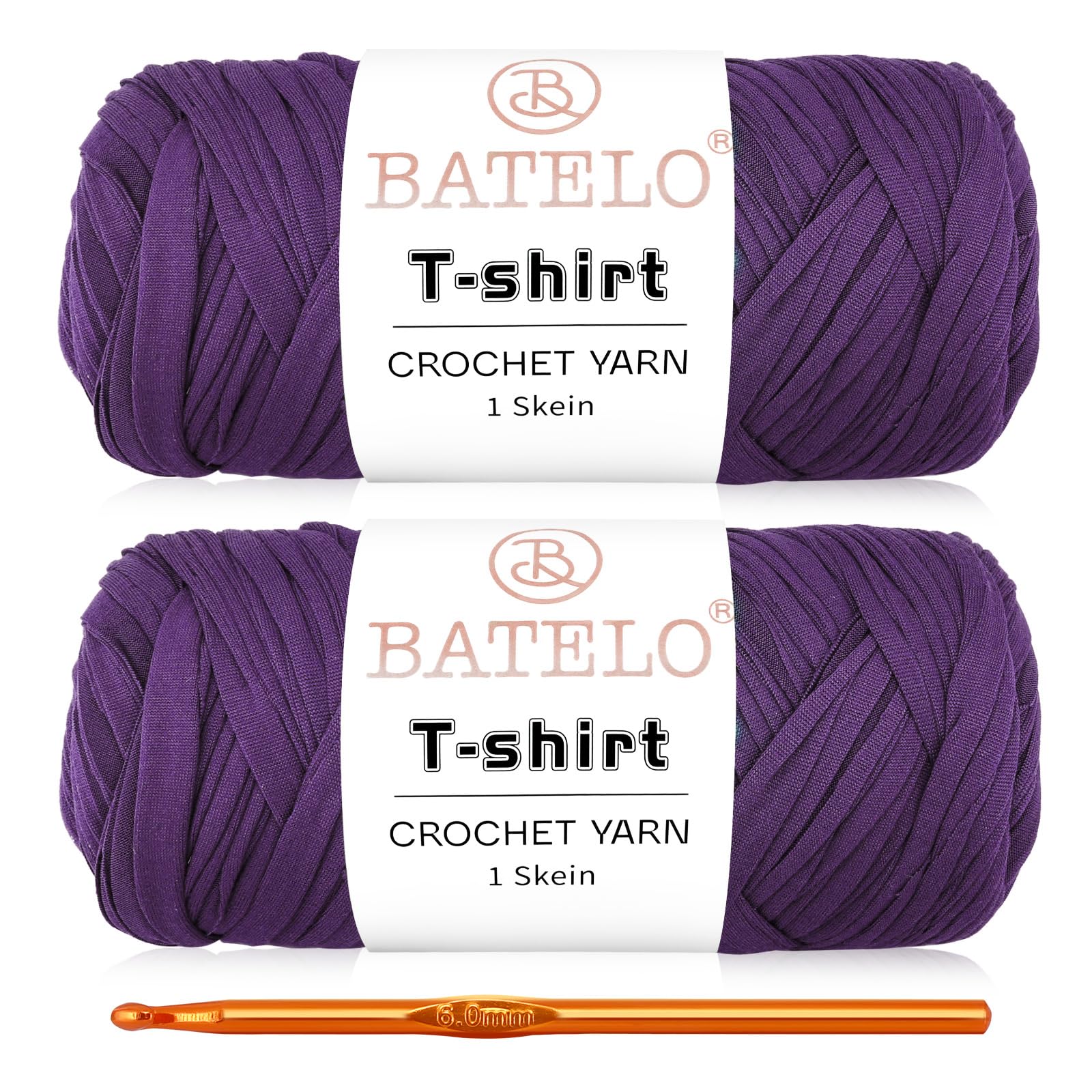 Two purple BATELO T-shirt yarn skeins with a gold crochet hook on a white background