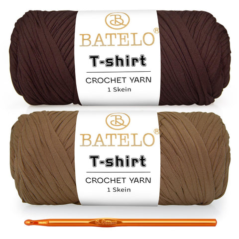 Two brown and tan BATELO T-shirt yarn skeins with a gold crochet hook on a white background