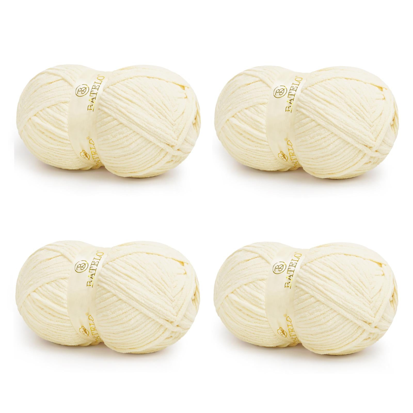 Four cream BATELO bulky chenille blanket yarn skeins arranged on a white background