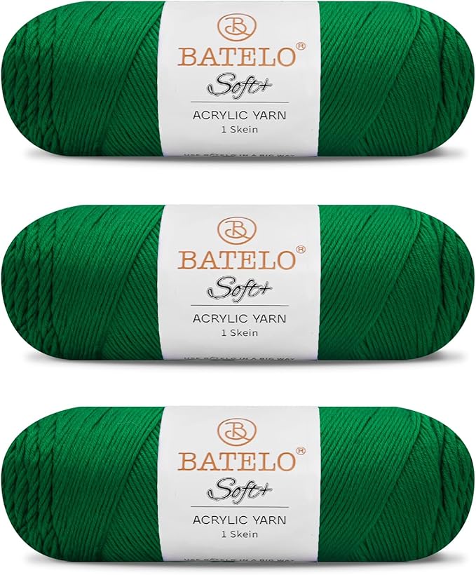 Three emerald green BATELO medium acrylic yarn skeins with white labels on a white background