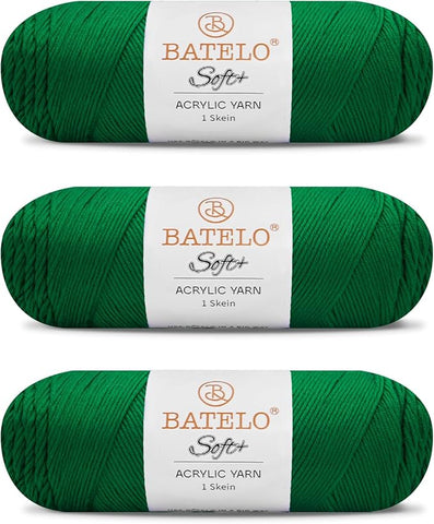 Three emerald green BATELO medium acrylic yarn skeins with white labels on a white background