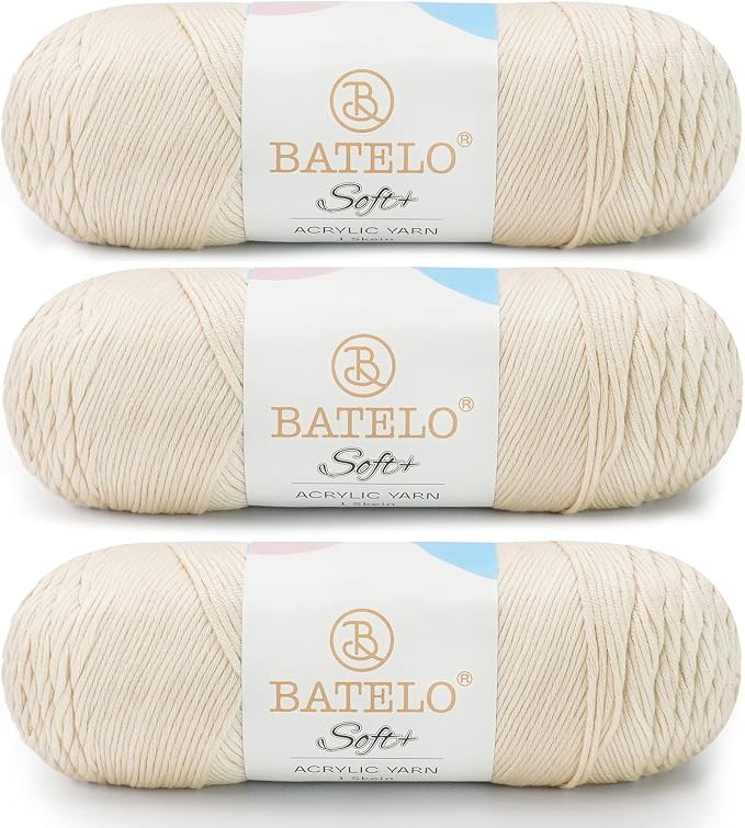 Three cream BATELO medium acrylic yarn skeins with white labels on a white background
