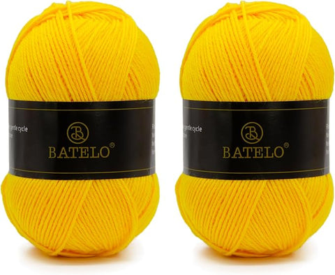 Two yellow BATELO light acrylic yarn skeins with branded bands on a white background