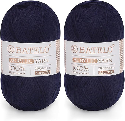 Two navy blue BATELO light acrylic yarn skeins with branded bands on a white background