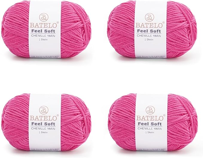 Four magenta BATELO thin chenille yarn skeins with Feel Soft labels on a white background