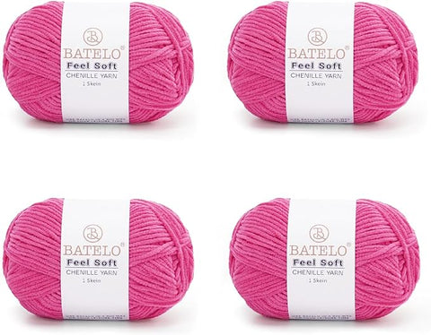 Four magenta BATELO thin chenille yarn skeins with Feel Soft labels on a white background
