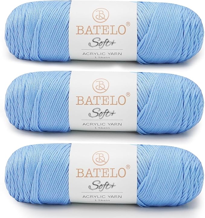 Three light blue BATELO medium acrylic yarn skeins with white labels on a white background