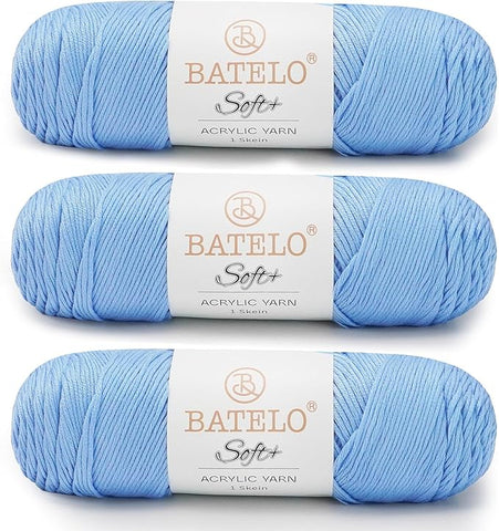 Three light blue BATELO medium acrylic yarn skeins with white labels on a white background