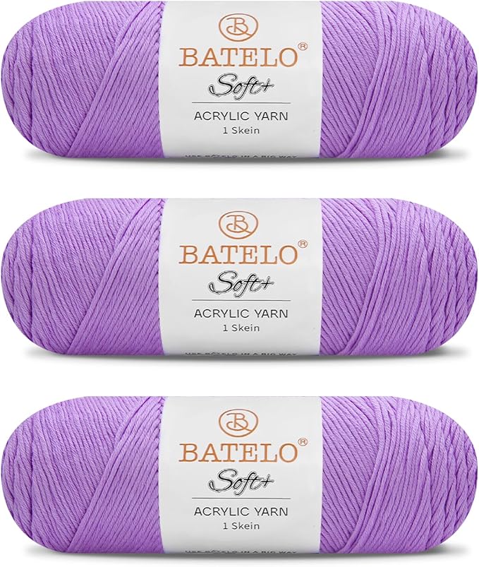 Three lavender BATELO medium acrylic yarn skeins with white labels on a white background