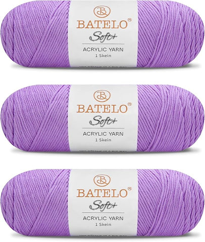Three lavender BATELO medium acrylic yarn skeins with white labels on a white background