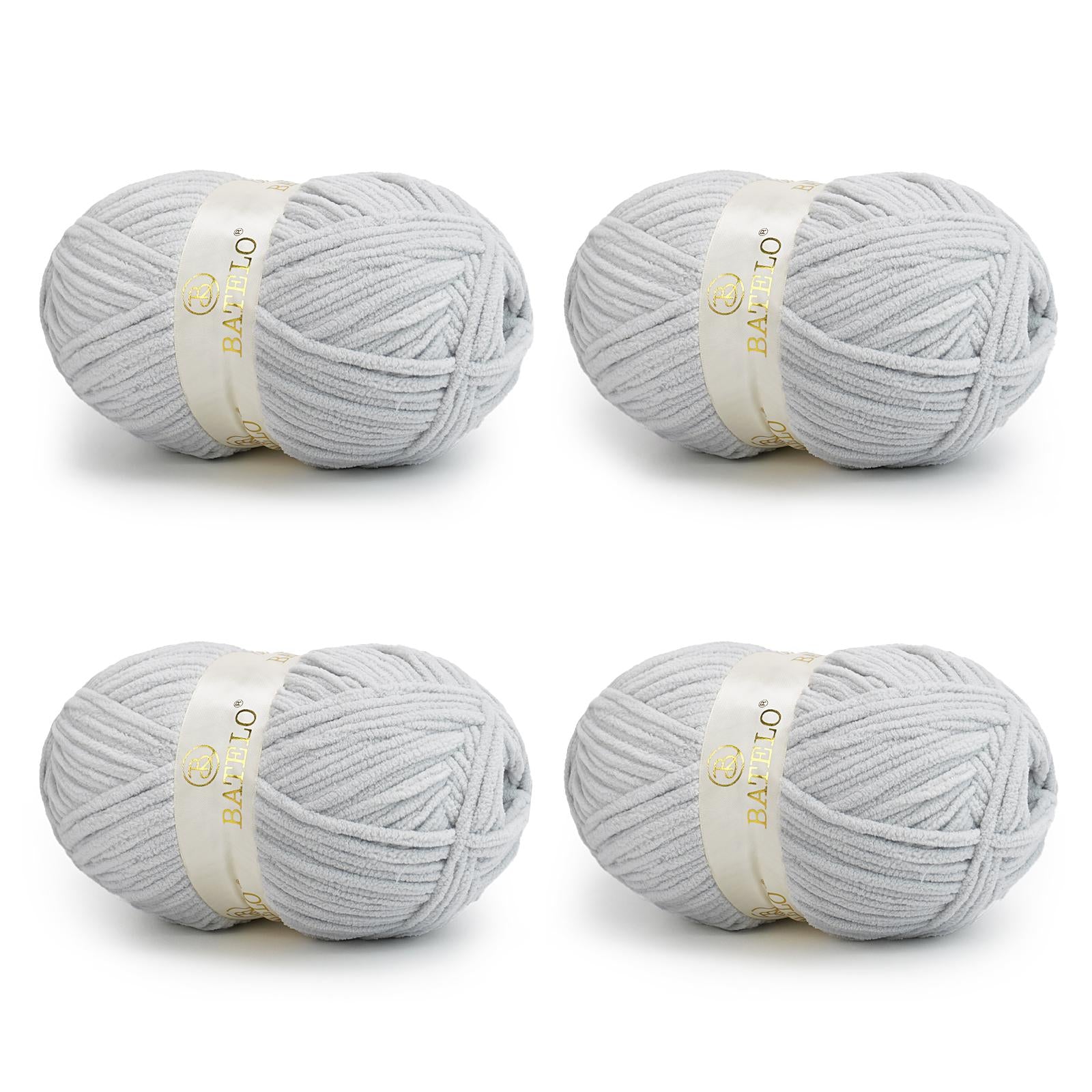 Four light gray BATELO bulky chenille blanket yarn skeins arranged on a white background
