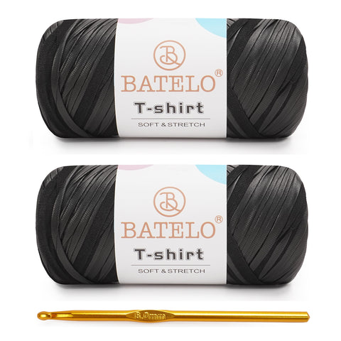 Two black BATELO leather-look T-shirt yarn skeins with branded labels on a white background