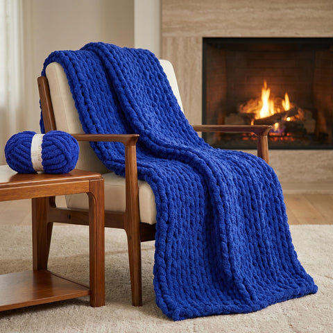 Royal Blue chunky chenille knit blanket draped over a wooden chair beside a lit fireplace