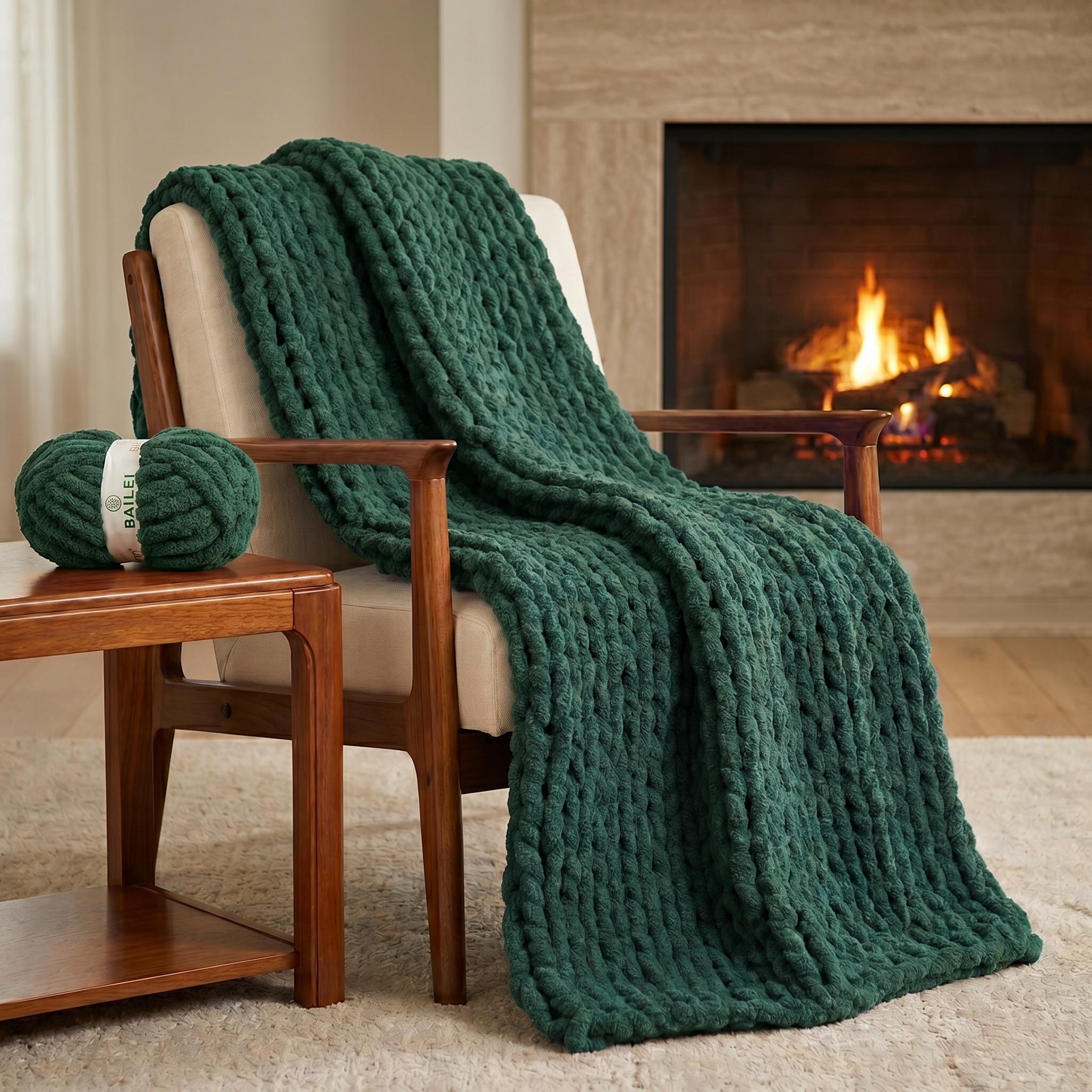 Deep Teal chunky chenille knit blanket draped over a wooden chair beside a lit fireplace