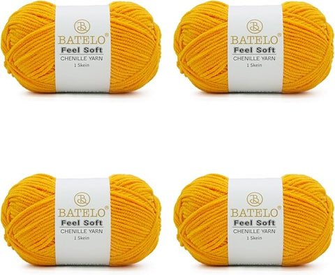 Four golden yellow BATELO thin chenille yarn skeins with Feel Soft labels on a white background